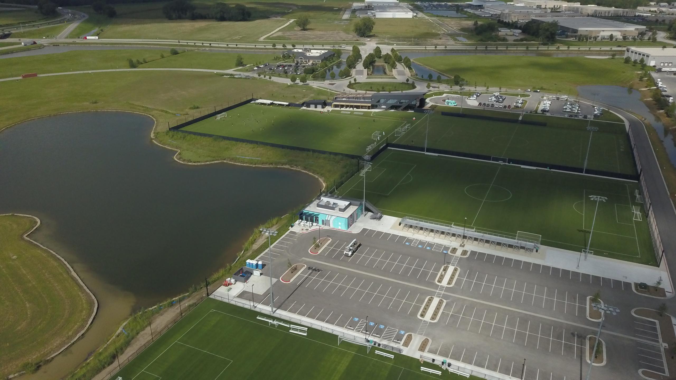 View of front three training pitches with parking.