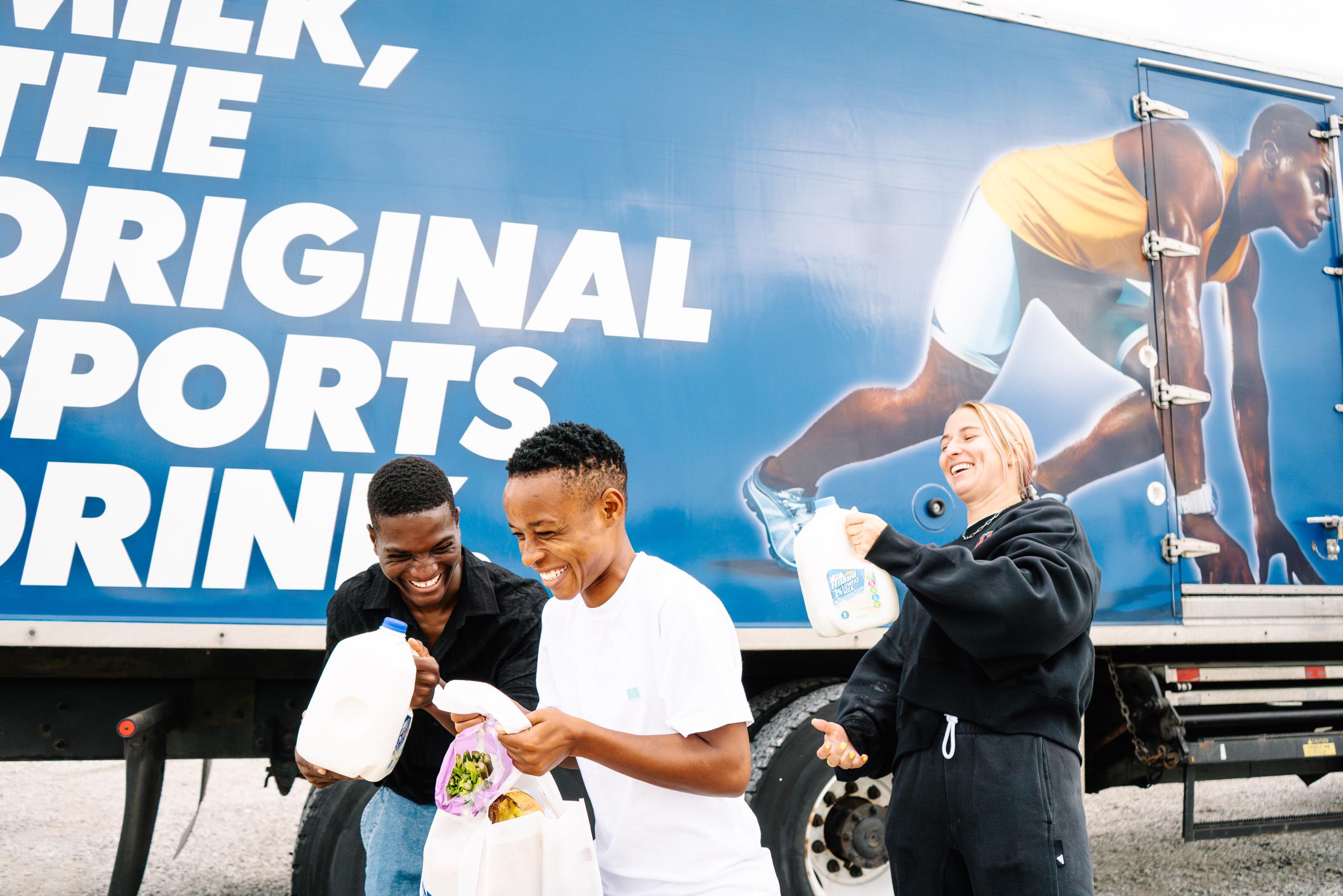 Temwa, Jereko and Hailie donating milk