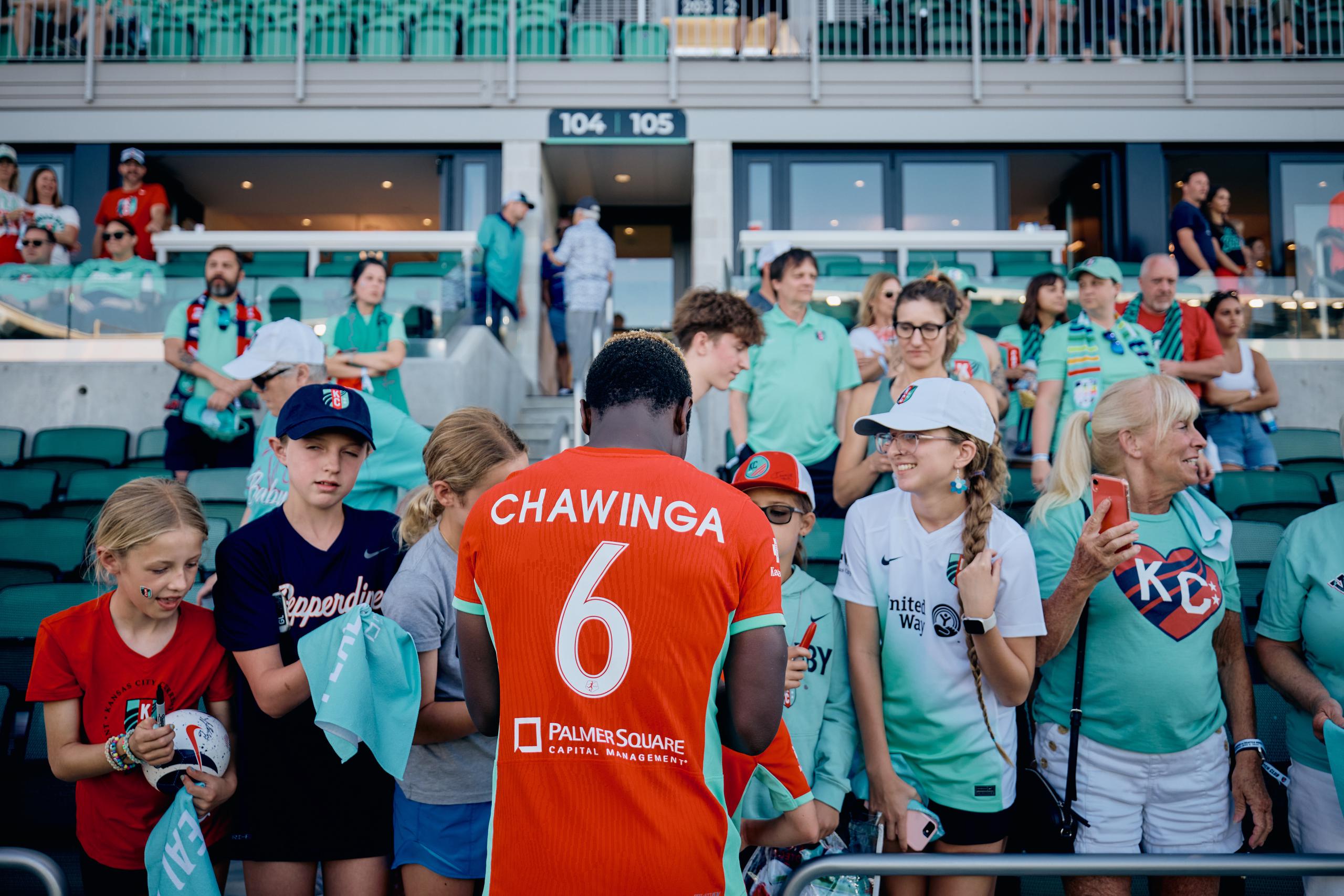 Fans are getting autographs from players in their pitch club seats.