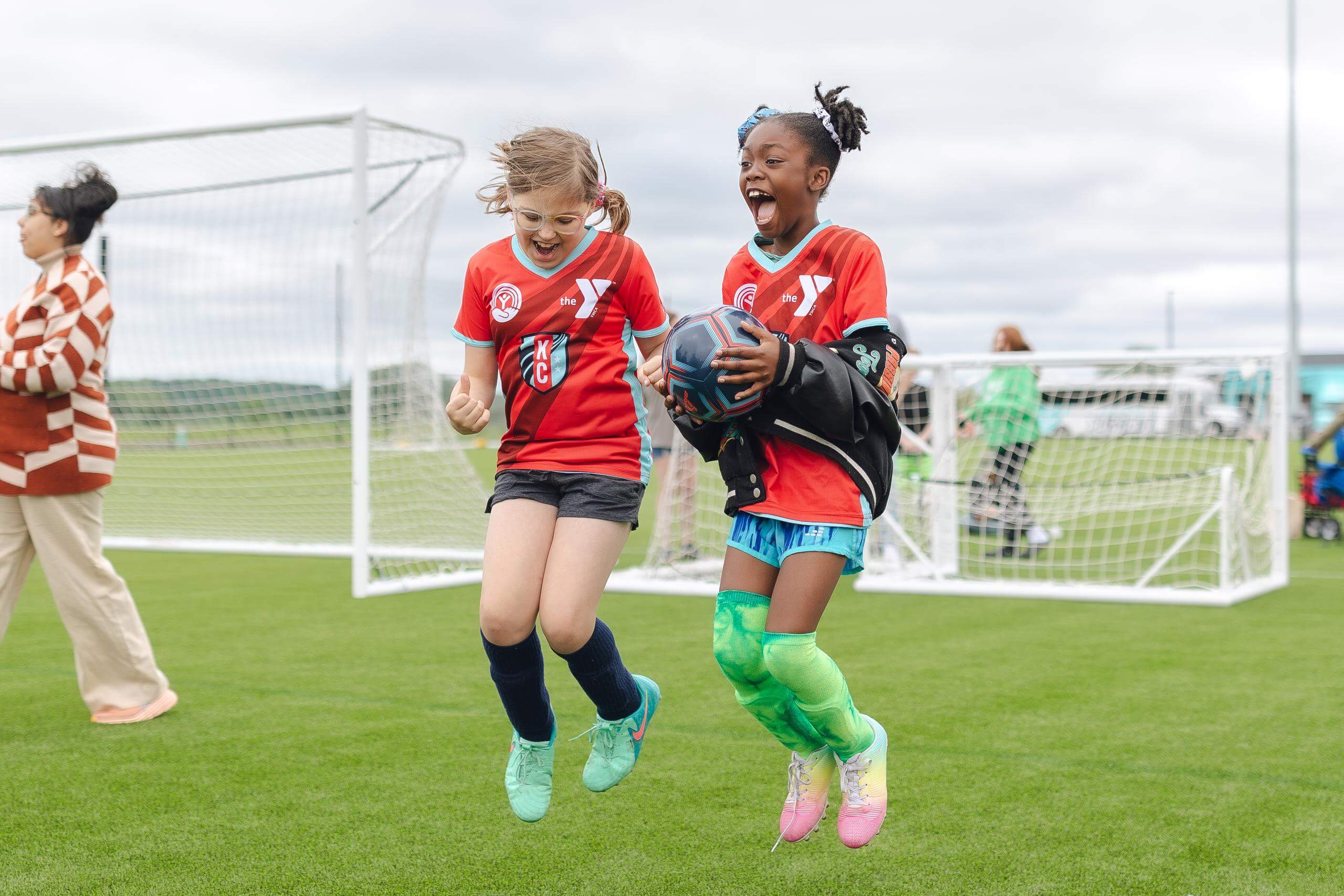 YMCA Soccer program players playing soccer.