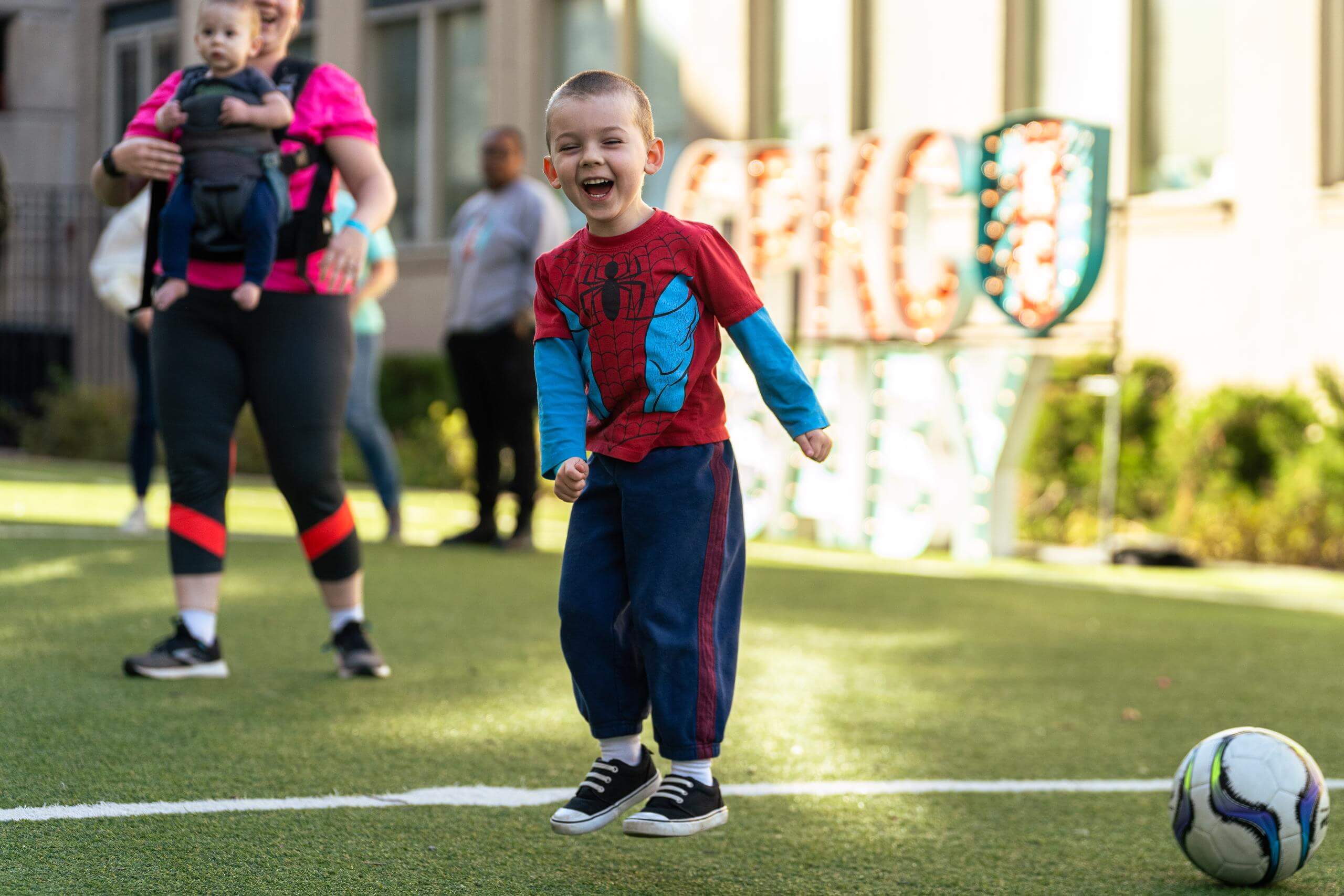 A smiling boy at the heart health ymca party.