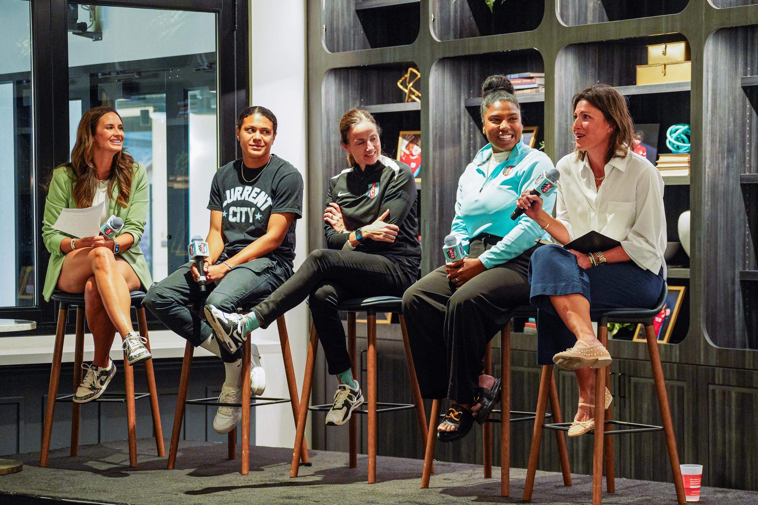 Panel of players and career professionals speaking at in her boots event.