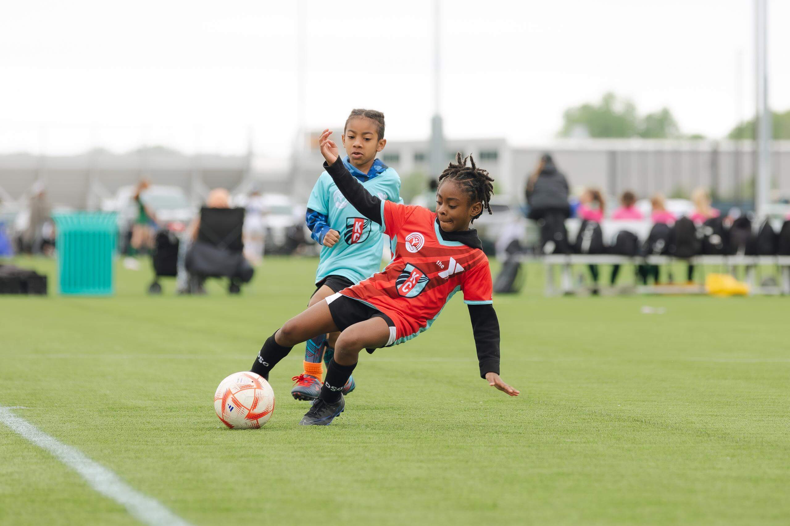 YMCA Soccer program players playing soccer.