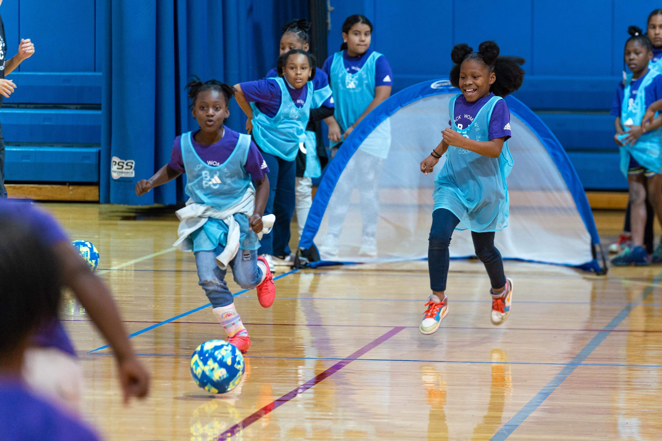 Students from the Boys and Girls club playing soccer at Black Women's players collective clinic.